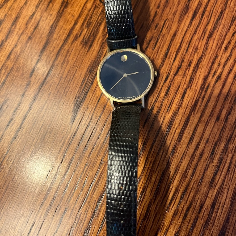 Movado Black and Gold Minimalist Watch